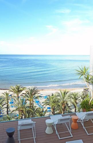 a view of the beach from the balcony of a resort at Hotel Montemar in Benidorm
