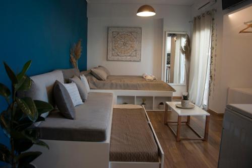 a living room with a couch and a table at Sealake View in Mesolongion