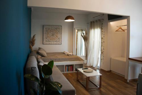 a living room with a couch and a bed at Sealake View in Mesolongion