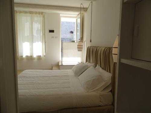 Katil atau katil-katil dalam bilik di Masseria Bandino & Spa