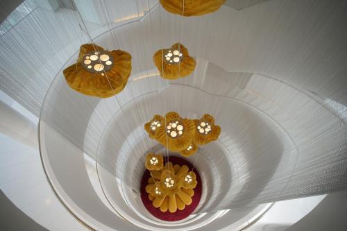 an overhead view of three cakes with flowers on them at Five Flowers Hotel Formentera, member of Melia Collection in Es Pujols