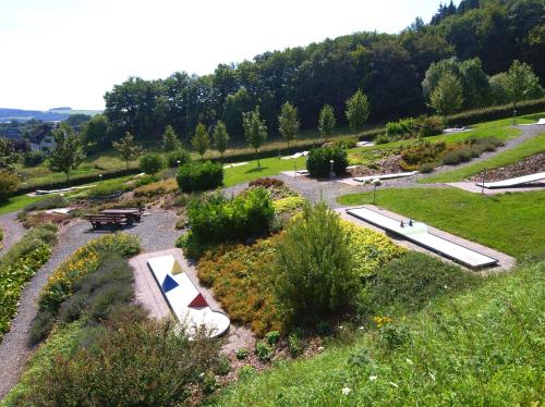an overhead view of a park with a picnic table and benches at Hotel Hesborner Kuckuck in Hallenberg