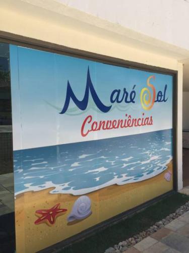a sign for an art center on the beach at Beach Class Resort 2 quartos Muro Alto BMS in Porto De Galinhas