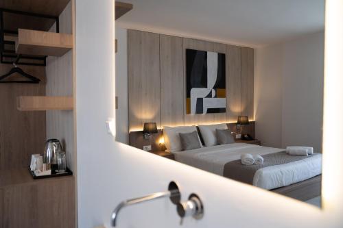 Ένα ή περισσότερα κρεβάτια σε δωμάτιο στο Galaxy Hotel