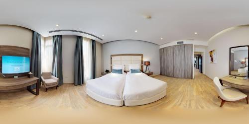 Un ou plusieurs lits dans un hébergement de l'établissement Simaisma A Murwab Resort