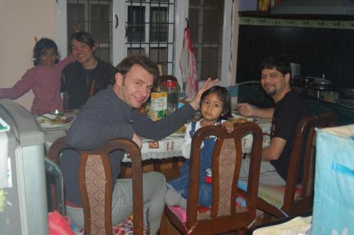 a group of people sitting around a table at Shine Homestay Famille Francophone - Shine Home and Apartment in Kathmandu