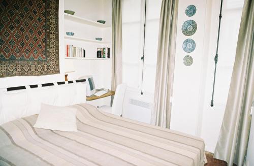 a bedroom with a bed and a window at Latin Quarter - Saint Michel Unit 004 in Paris