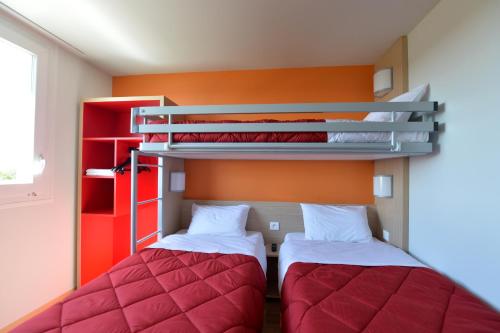 Cama o camas de una habitación en Premiere Classe Reims Nord - Bétheny