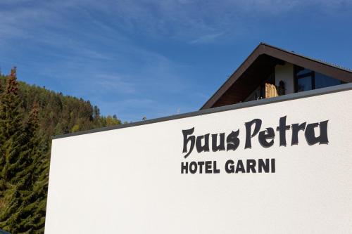 a sign for the louis reuter hotel gamma at Hotel Petra in Baiersbronn