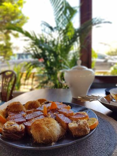 a plate of food sitting on a table at Maison 66, Riviera Hotels in Athens