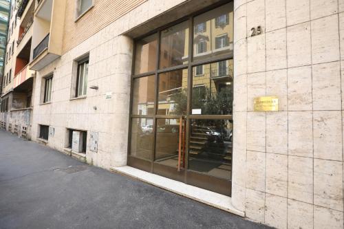 a building with glass windows on the side of it at Unique luxury apartment and rooms in Rome