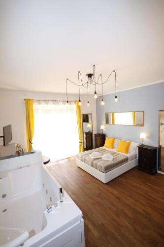 a bedroom with a bed and two sinks and a mirror at Unique luxury apartment and rooms in Rome