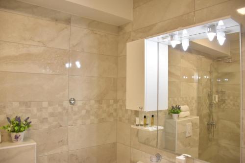 a bathroom with a shower and a sink at Villa Riva in Makarska