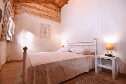 Posteľ alebo postele v izbe v ubytovaní House & Apartment Palača