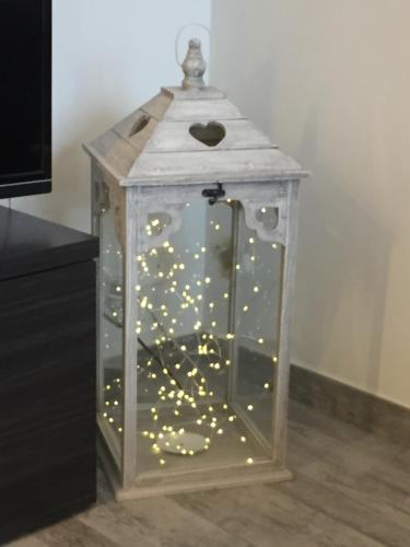a glass lantern with lights in a room at La Gufetta in Varese