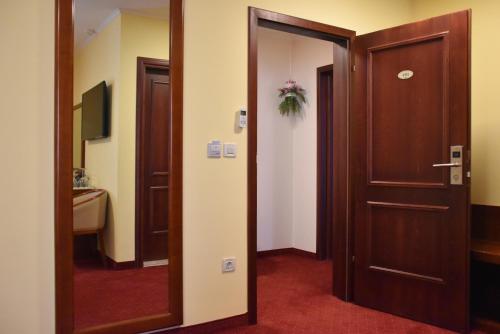 an open door to a room with a bathroom at Villa Riva in Makarska