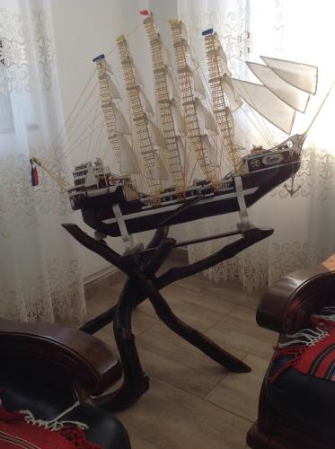 a model ship on a stand in a room at Laguna Verde in Crivina