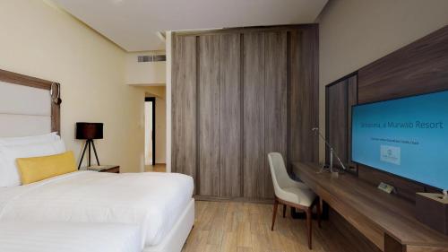 Télévision ou salle de divertissement dans l'établissement Simaisma A Murwab Resort