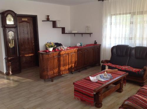 a living room with a couch and a table at Laguna Verde in Crivina