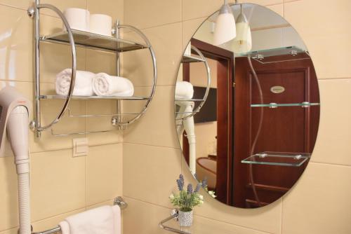 a bathroom with a mirror and a sink at Villa Riva in Makarska