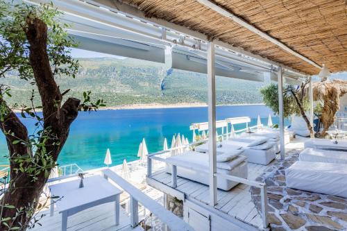 a resort with a view of the water at Club Çapa Hotel in Kas