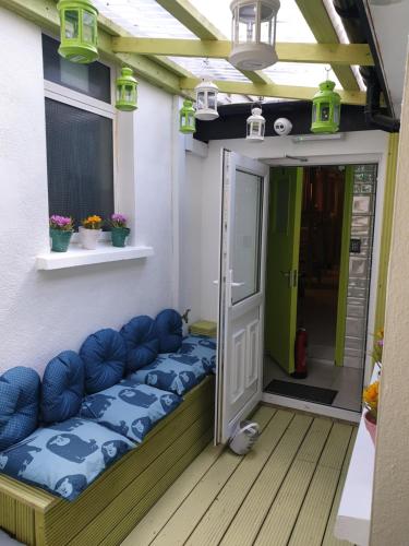 a small house with a couch on the porch at KGT House in Dublin