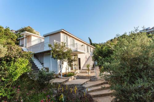 a house on the side of a hill at Club Çapa Hotel in Kas