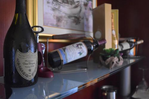 a bottle of wine sitting on a shelf at Villa Riva in Makarska