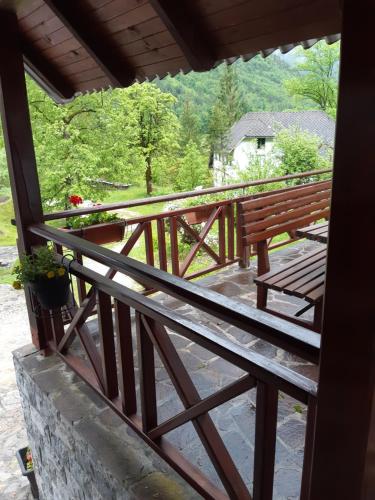 a view of a balcony with a bench and a table at Apartment Zorc in Trenta