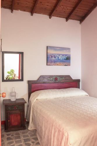 a bedroom with two beds in a room at Hotel La Casona in Jardin