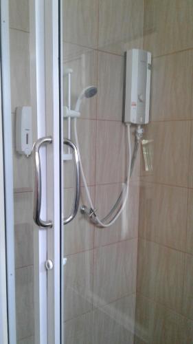 a shower with a shower head in a bathroom at Mountain View resort in Pran Buri