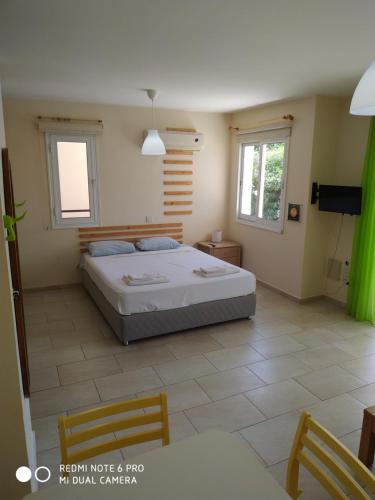 Ένα ή περισσότερα κρεβάτια σε δωμάτιο στο Anastasia Apartments