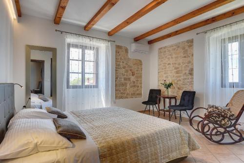 Un pat sau paturi într-o cameră la Palazzo 1812