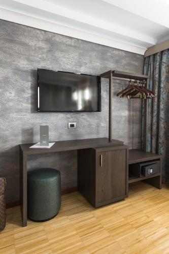 an office with a desk with a monitor on a wall at Venice Maggior Consiglio in Venice