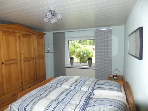 Katil atau katil-katil dalam bilik di Ferienwohnung Weserberglandblick