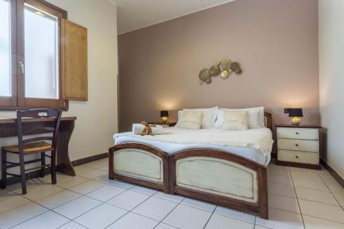Ένα ή περισσότερα κρεβάτια σε δωμάτιο στο Arcobaleno Rooms