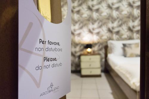 Ένα ή περισσότερα κρεβάτια σε δωμάτιο στο Arcobaleno Rooms