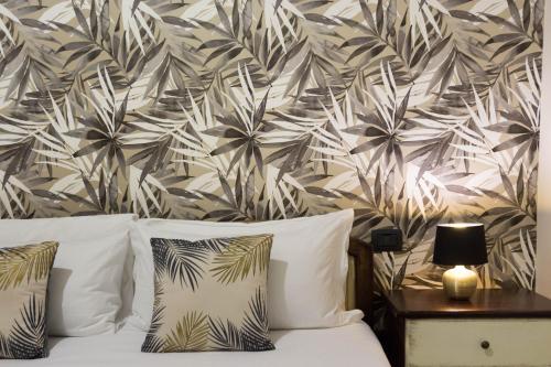 Ένα ή περισσότερα κρεβάτια σε δωμάτιο στο Arcobaleno Rooms