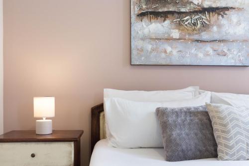 Ένα ή περισσότερα κρεβάτια σε δωμάτιο στο Arcobaleno Rooms