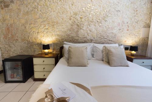 Ένα ή περισσότερα κρεβάτια σε δωμάτιο στο Arcobaleno Rooms