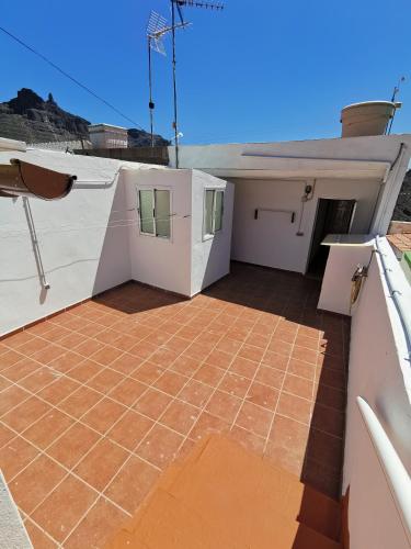 a view from the balcony of a house with a tile floor at Casa rural Juan y Juana Canino in Tejeda