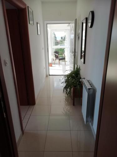 a hallway with a door leading to a room at Villa Kubo in Lovran