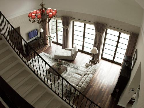 an overhead view of a living room with a staircase at Villa Victoria in Rydzewo