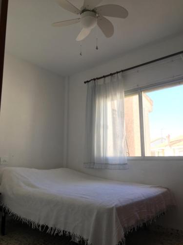 Ένα ή περισσότερα κρεβάτια σε δωμάτιο στο Flat with sea views 200m from the beach