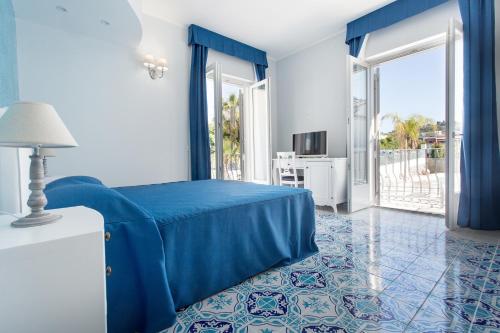 Postel nebo postele na pokoji v ubytování Odysseus Hotel