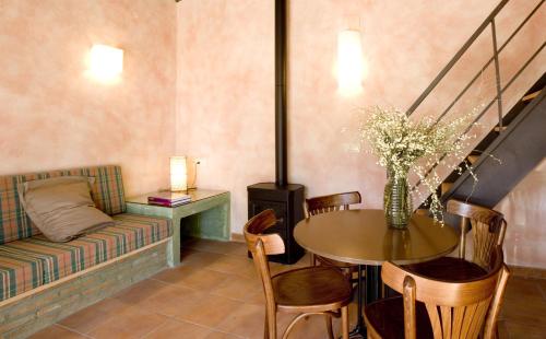 a living room with a couch and a table at Lo Alto in El Arenal