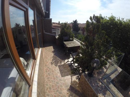 an outdoor patio with a table and chairs on a balcony at Meydan Suites in Istanbul