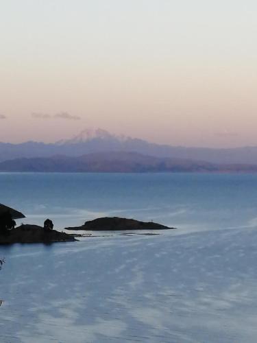 an island in the middle of a body of water at Hostal Puerto Alegre in Copacabana