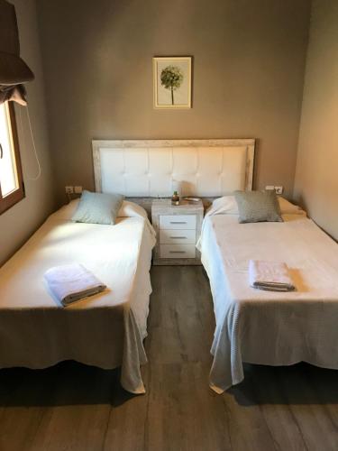 Katil atau katil-katil dalam bilik di Casa la Barbacana