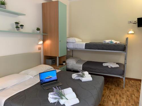 Postel nebo postele na pokoji v ubytování Hotel Palma Benessere